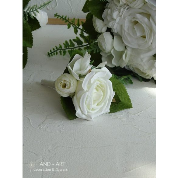 Groom boutonniere made of white silk flowers