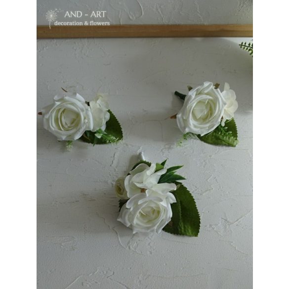 Groom boutonniere made of white silk flowers